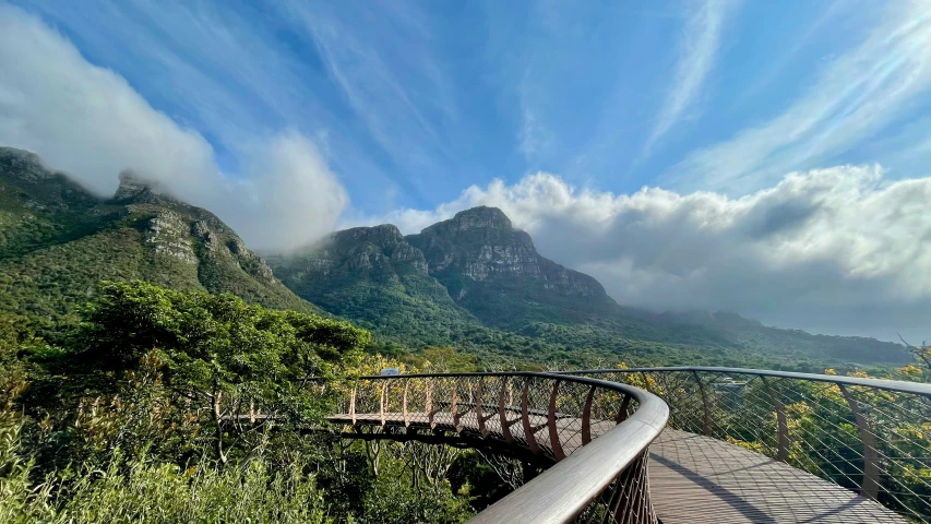 a winding road through lush green mountains