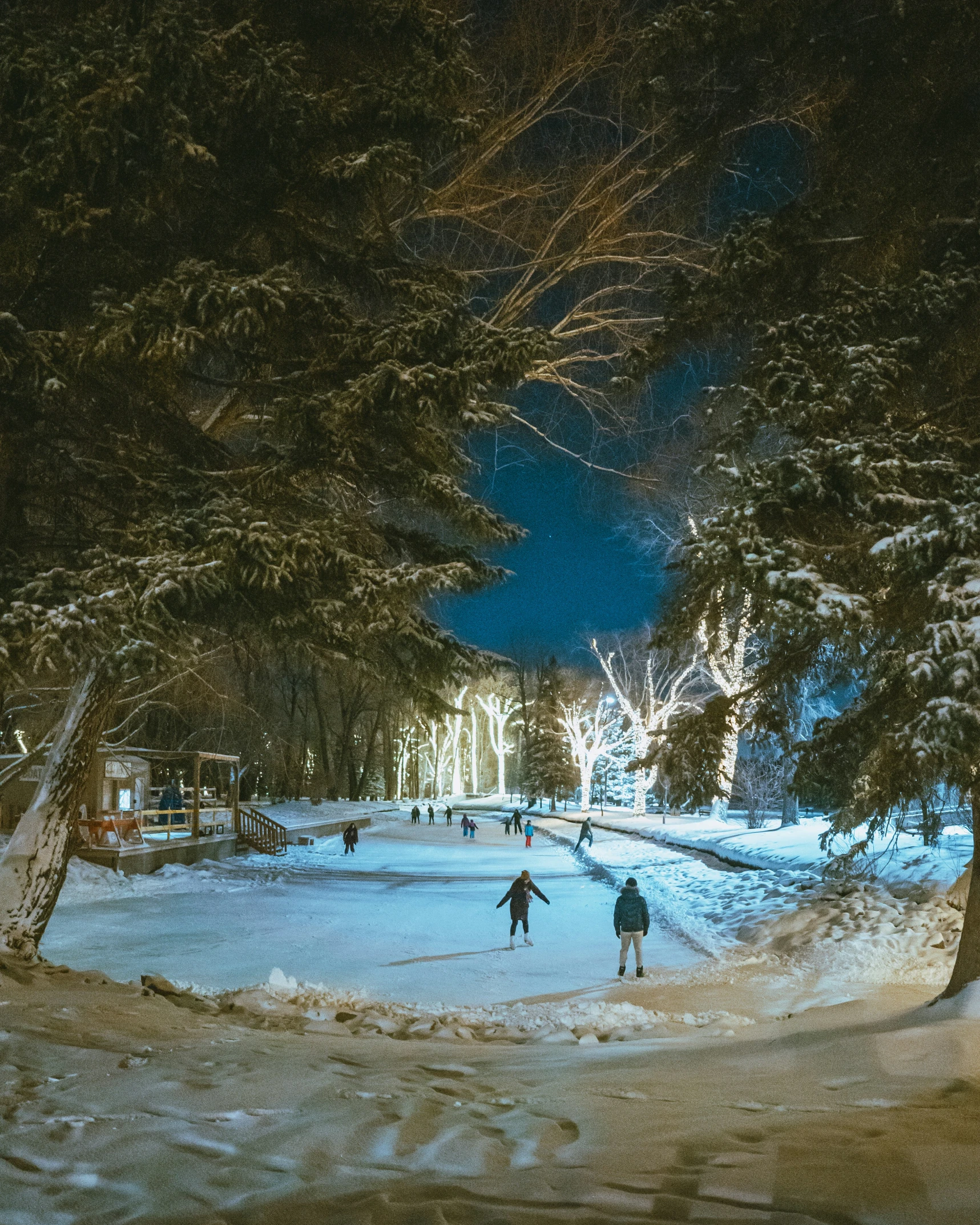 a view of people on a snowy street