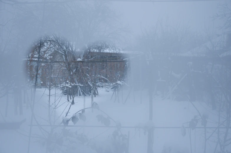 view through window of houses on snowy day