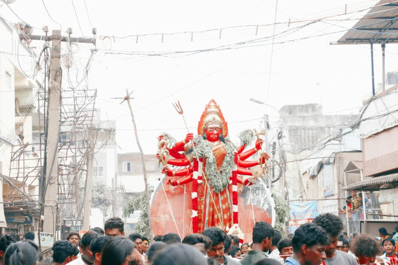 a float features a large figure in the street