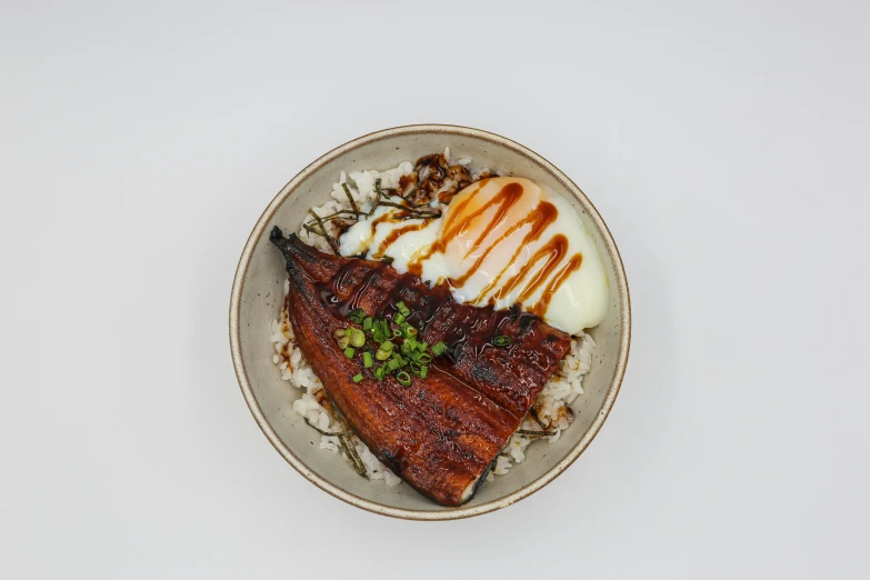 the plate has a dish with rice, meat and vegetables