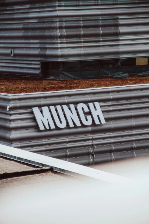 the munch logo is above the letters for a restaurant