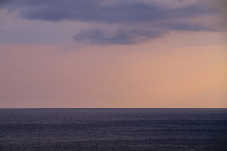 a large body of water with a sky background