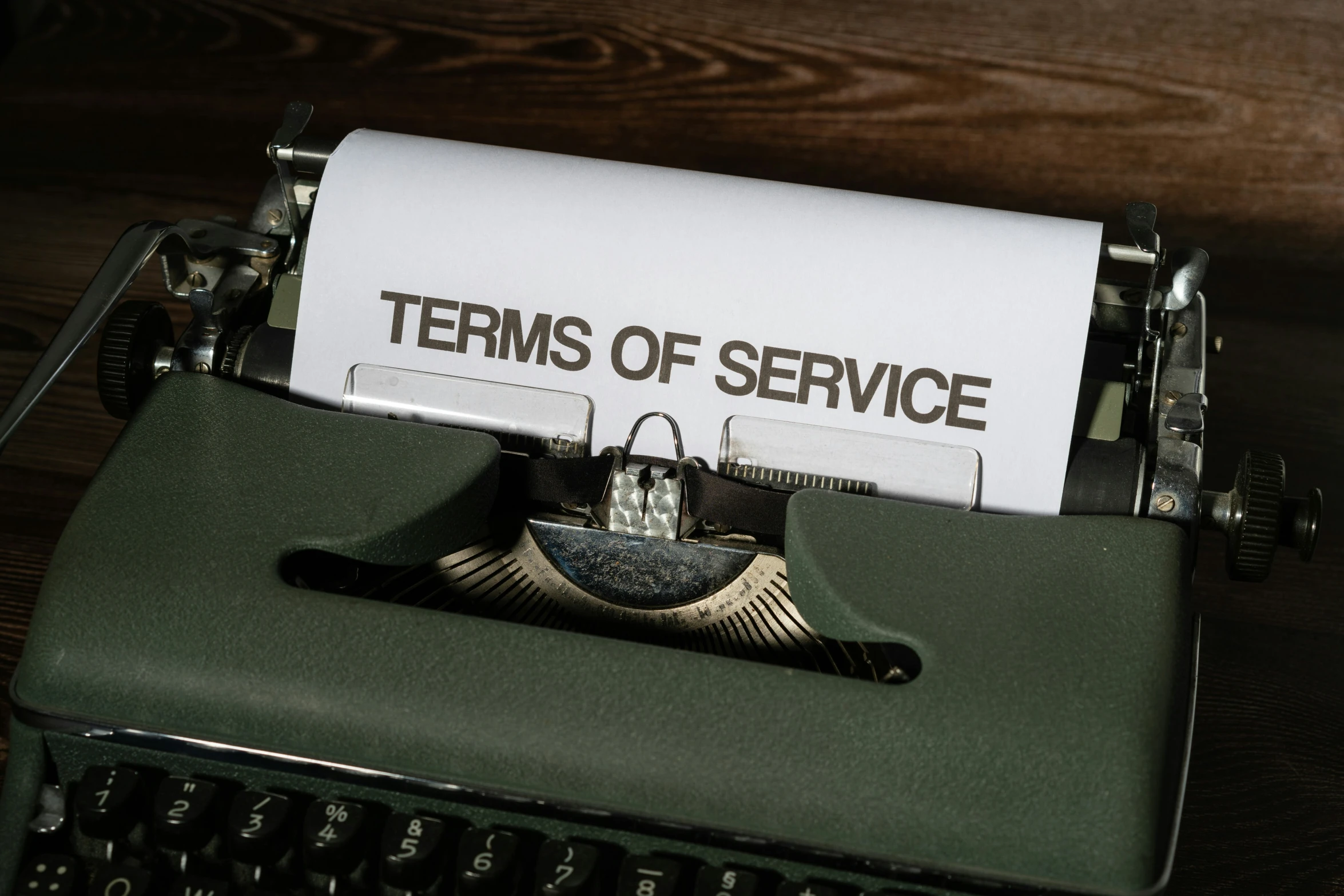 a close up s of an old typewriter with a white paper in it