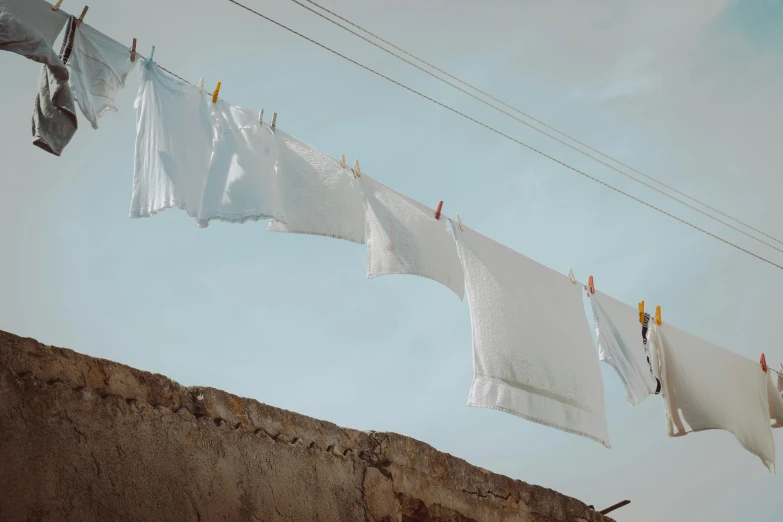 clothes hanging on the line outside of a house