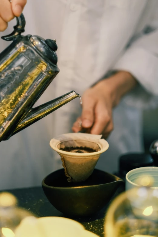 a person making some kind of thing in a pot