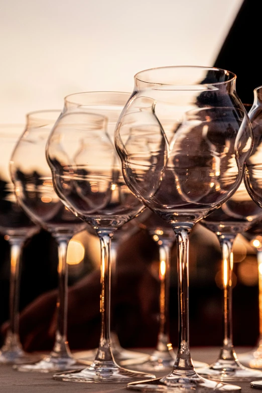 several wine glasses lined up on top of each other