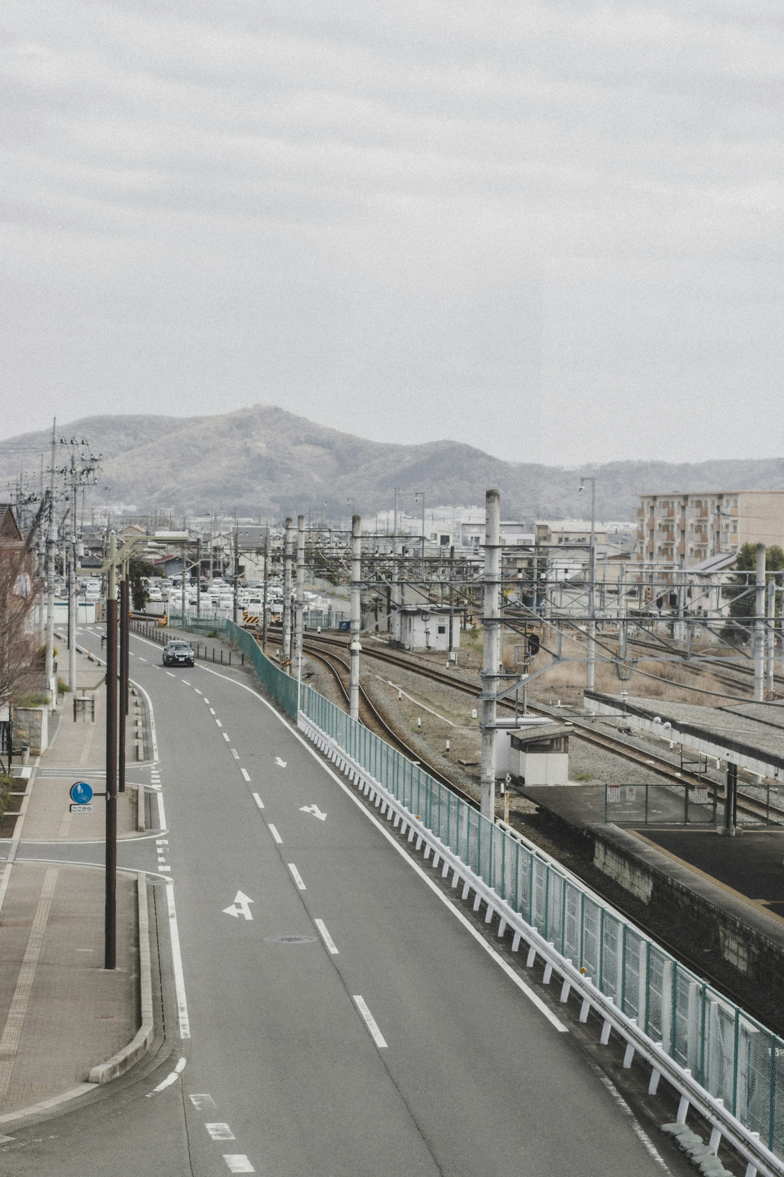 a long, empty road on a cloudy day