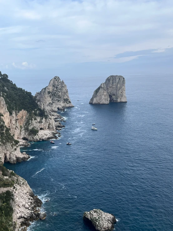 a body of water with some rock formations