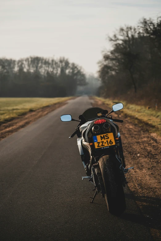 a motor bike parked on the side of a road