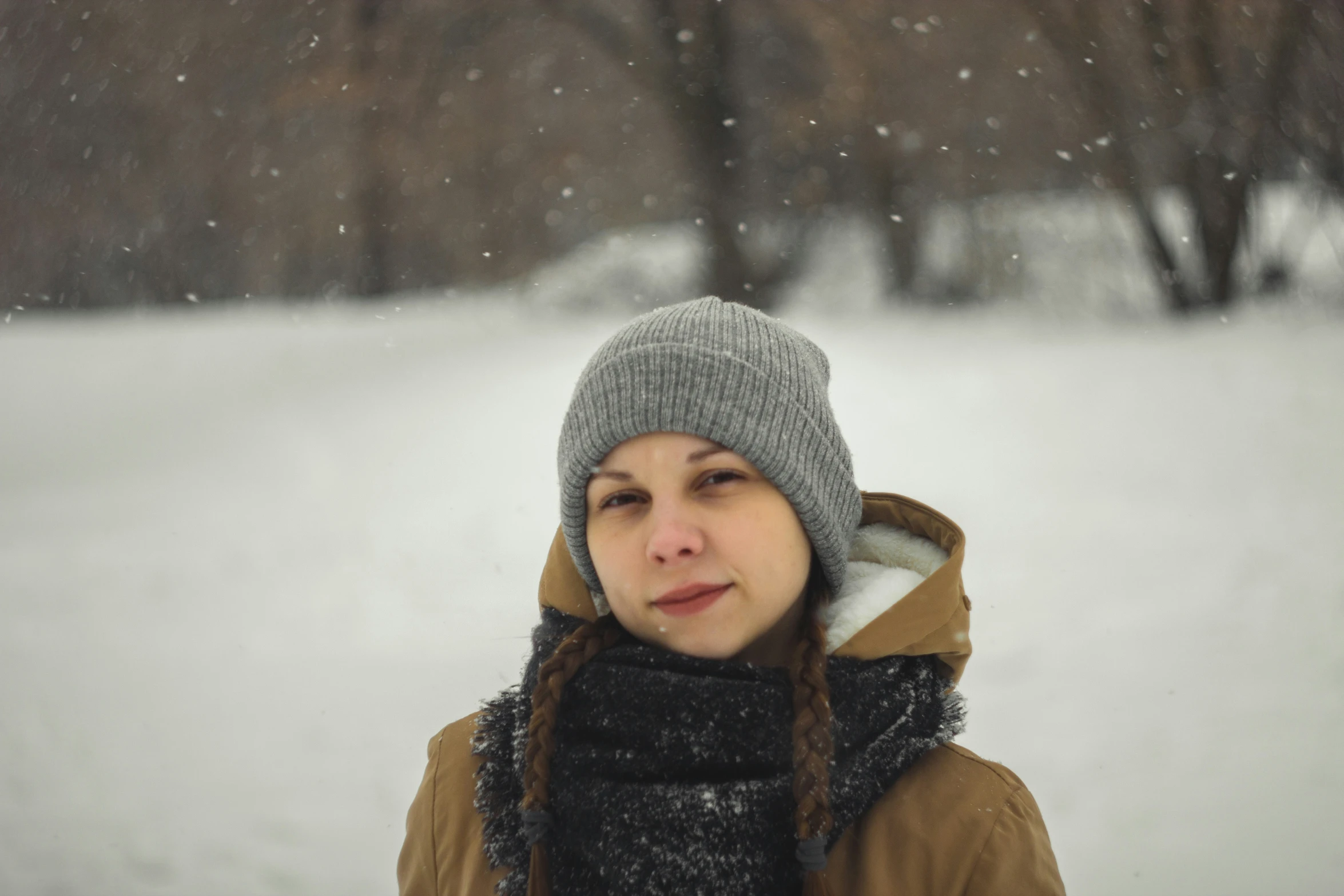 a girl in a warm coat in a snowy scene