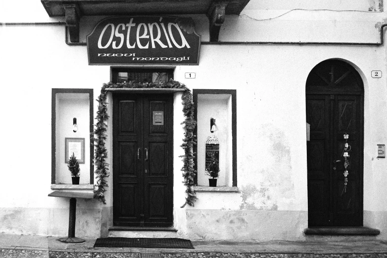 the front entrance of an old style restaurant