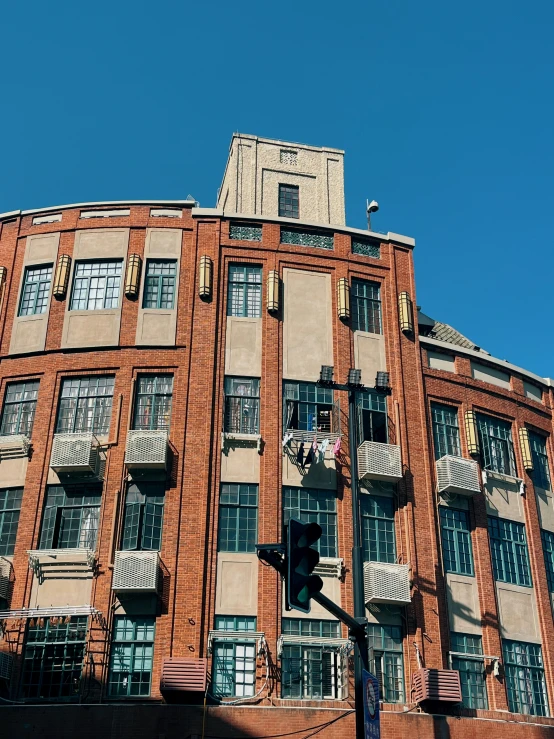 the top of a tall building with windows below