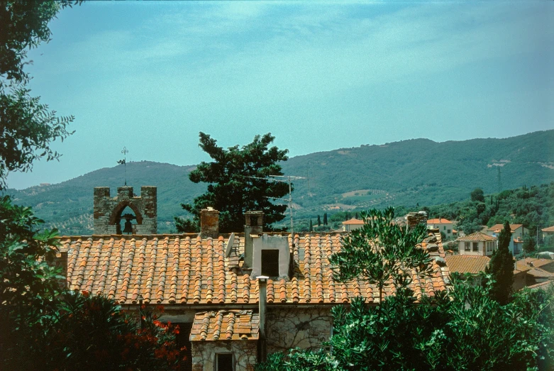 there are lots of houses with red tiled roof tops