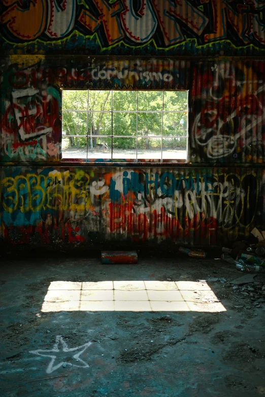 an empty, rundown building with graffiti on it