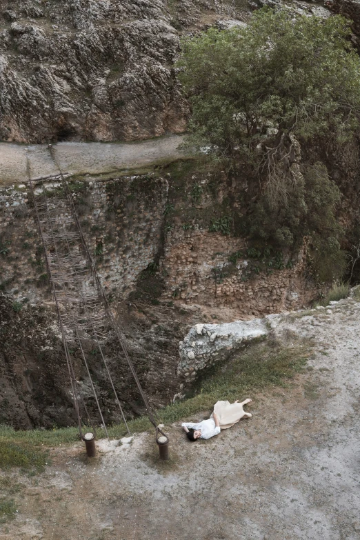 an aerial s of a swinging toy in a rocky valley