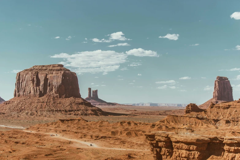 a view from an arid area with two tall rocks