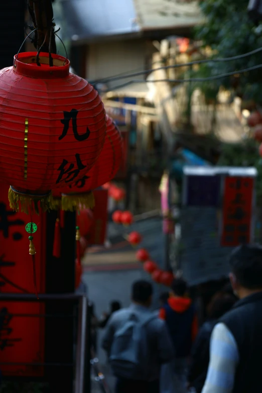 a red fire hydrant sitting on the side of a road