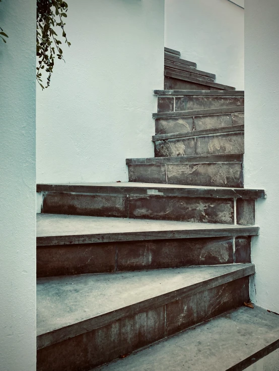 a set of stairs is shown up to the ceiling