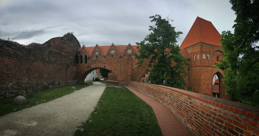 a castle is built around a small bridge