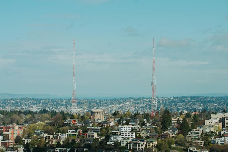 a picture of the city skyline taken from the hilltop