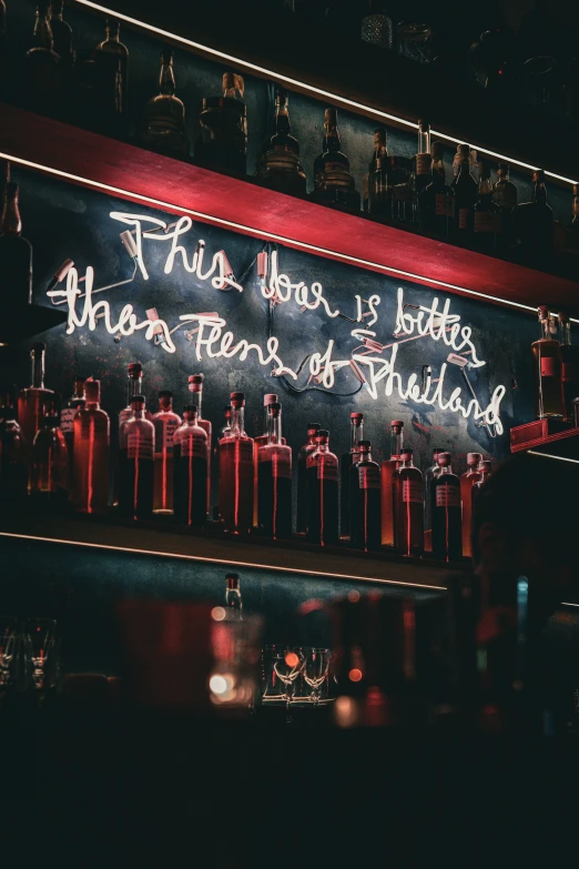 the neon sign on the bar is very colorful