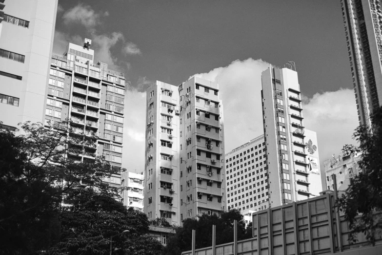 a black and white image of high rise apartment buildings