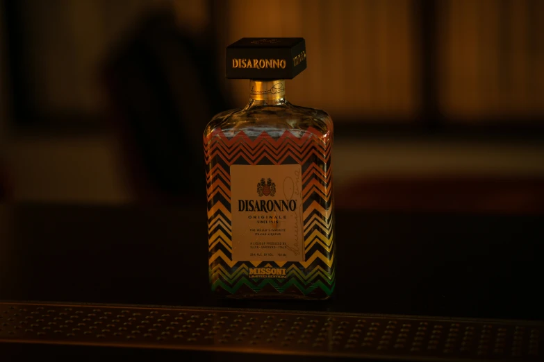 the small bottle of alcohol is decorated with a pattern