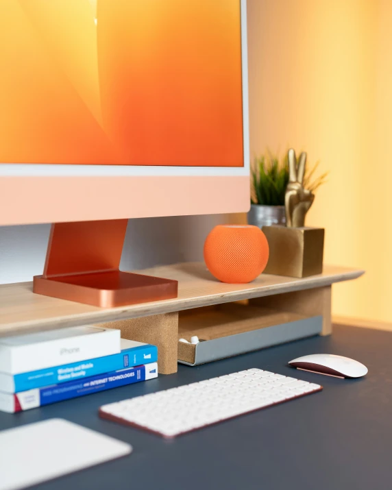 a desk with a keyboard, mouse and a desktop computer