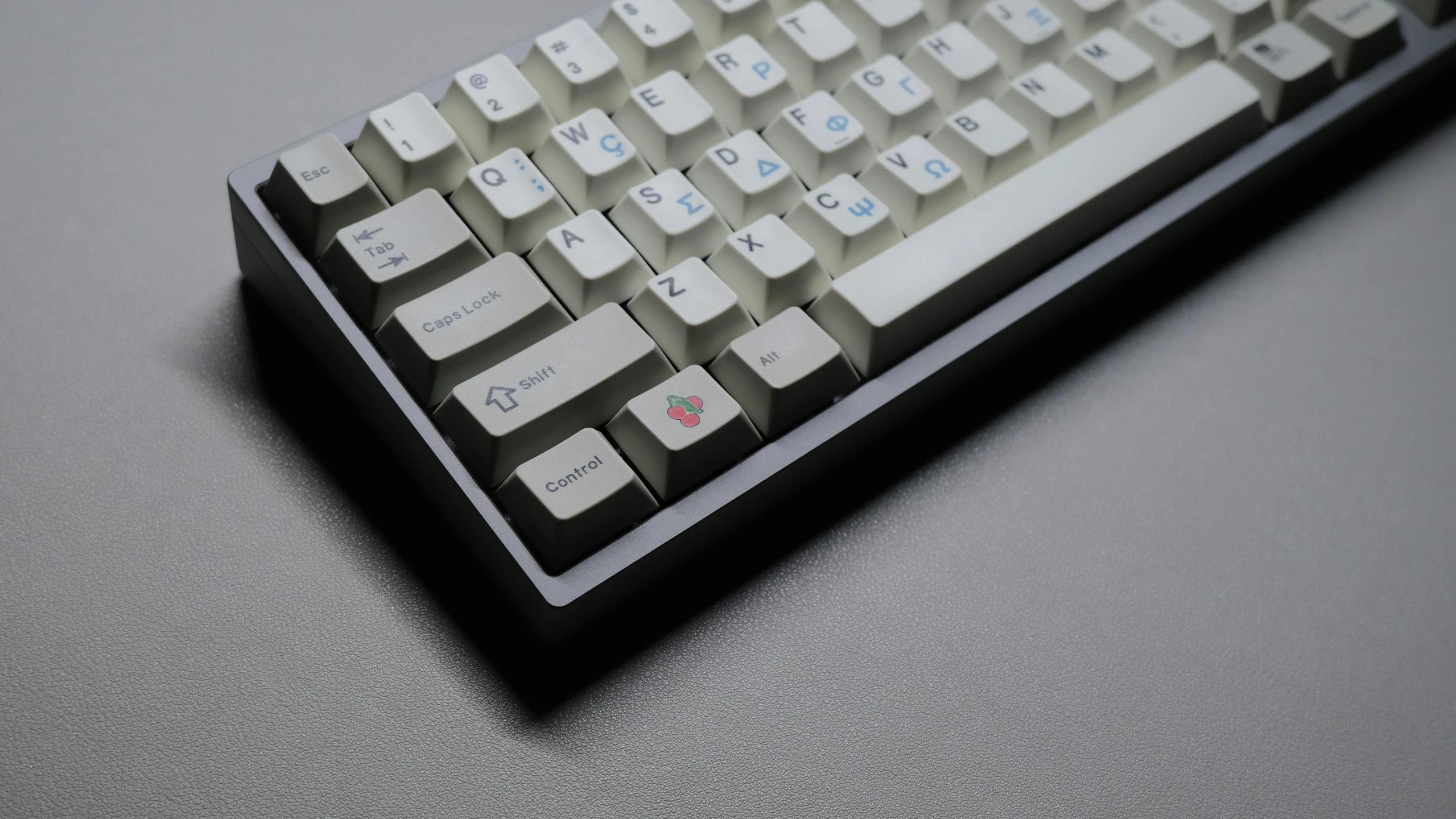 a white and black computer keyboard sitting on top of a table