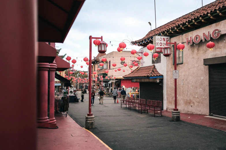 the entrance to a chinese restaurant and some people on either side