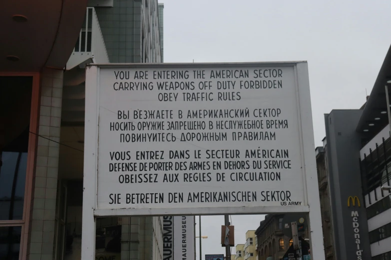 sign on a building stating that you are entering the american sector