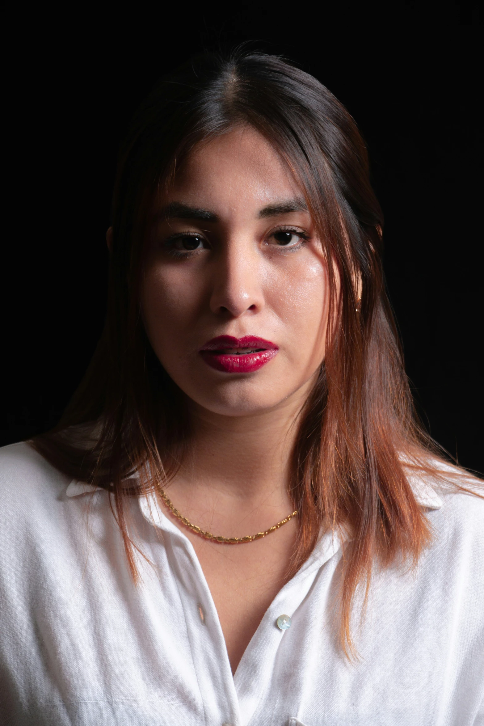 a woman with red lipstick posing for a picture