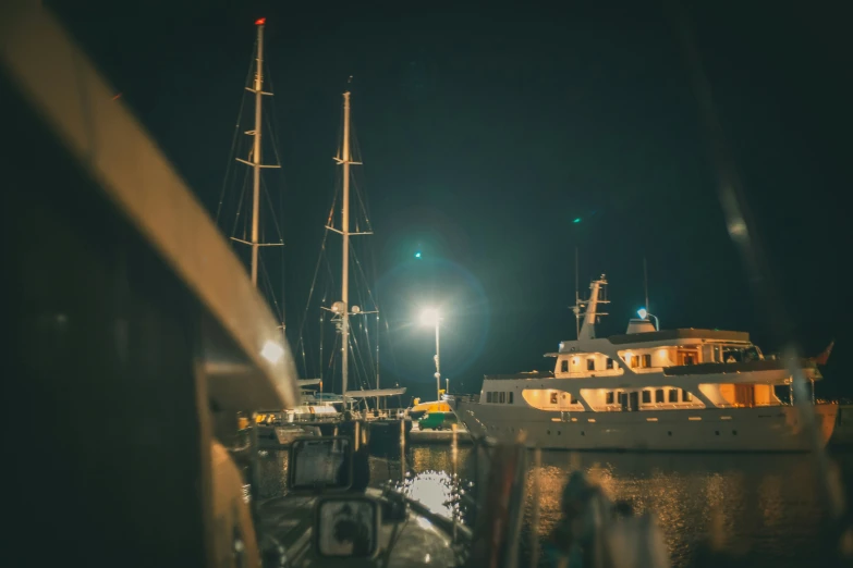 a ship is moored at a dock with a street light in the background