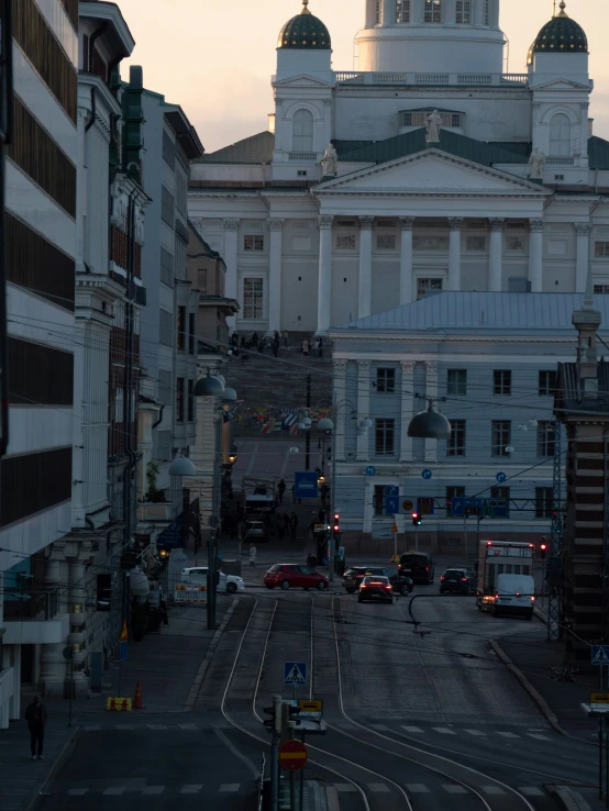 buildings are next to street intersection on a city street