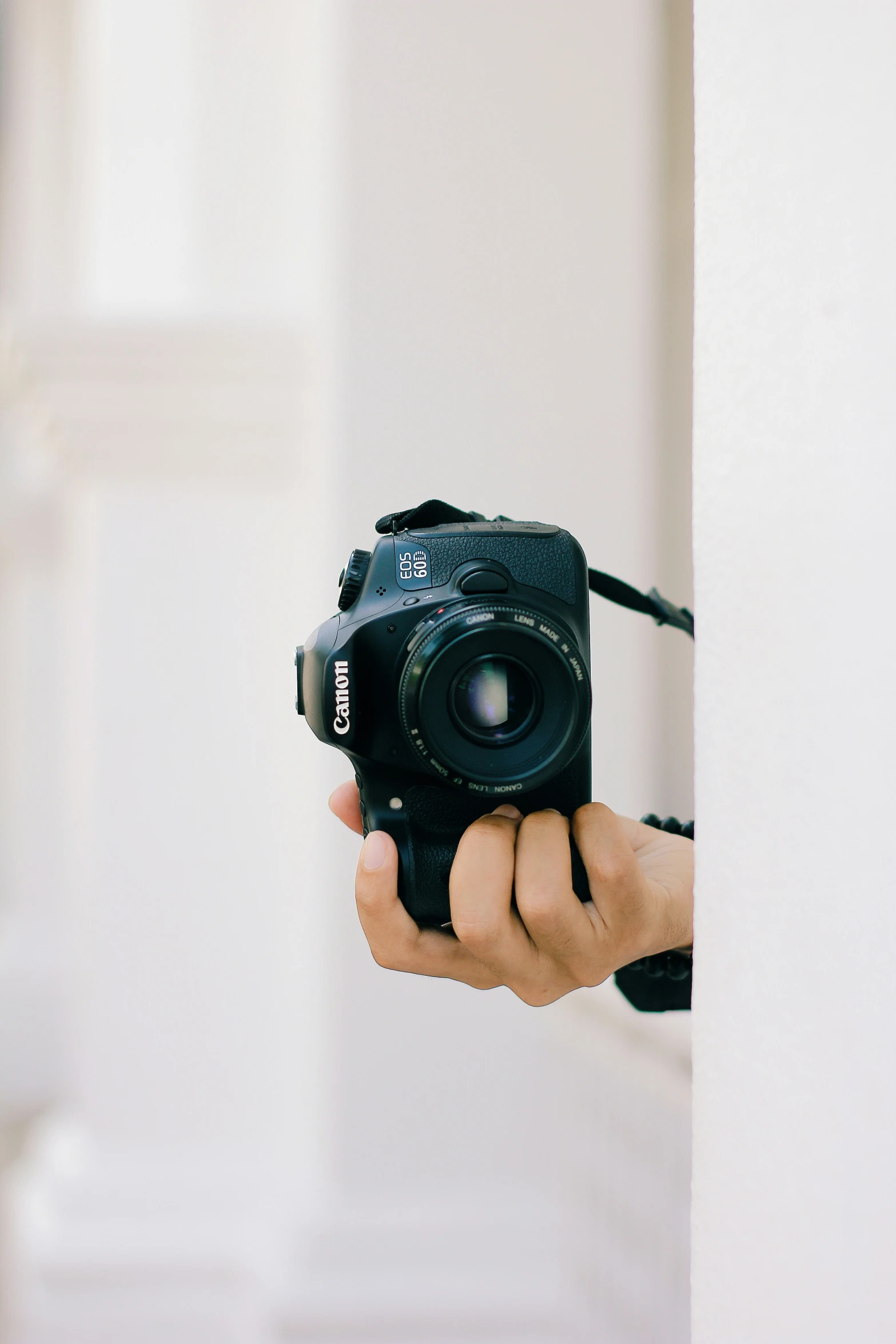 someone taking pictures in their cell phone in a room