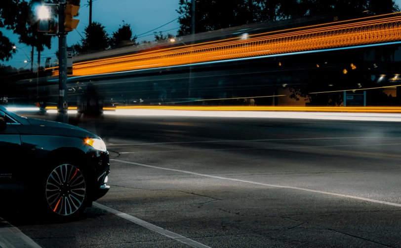 the view of a car parked in front of a stoplight