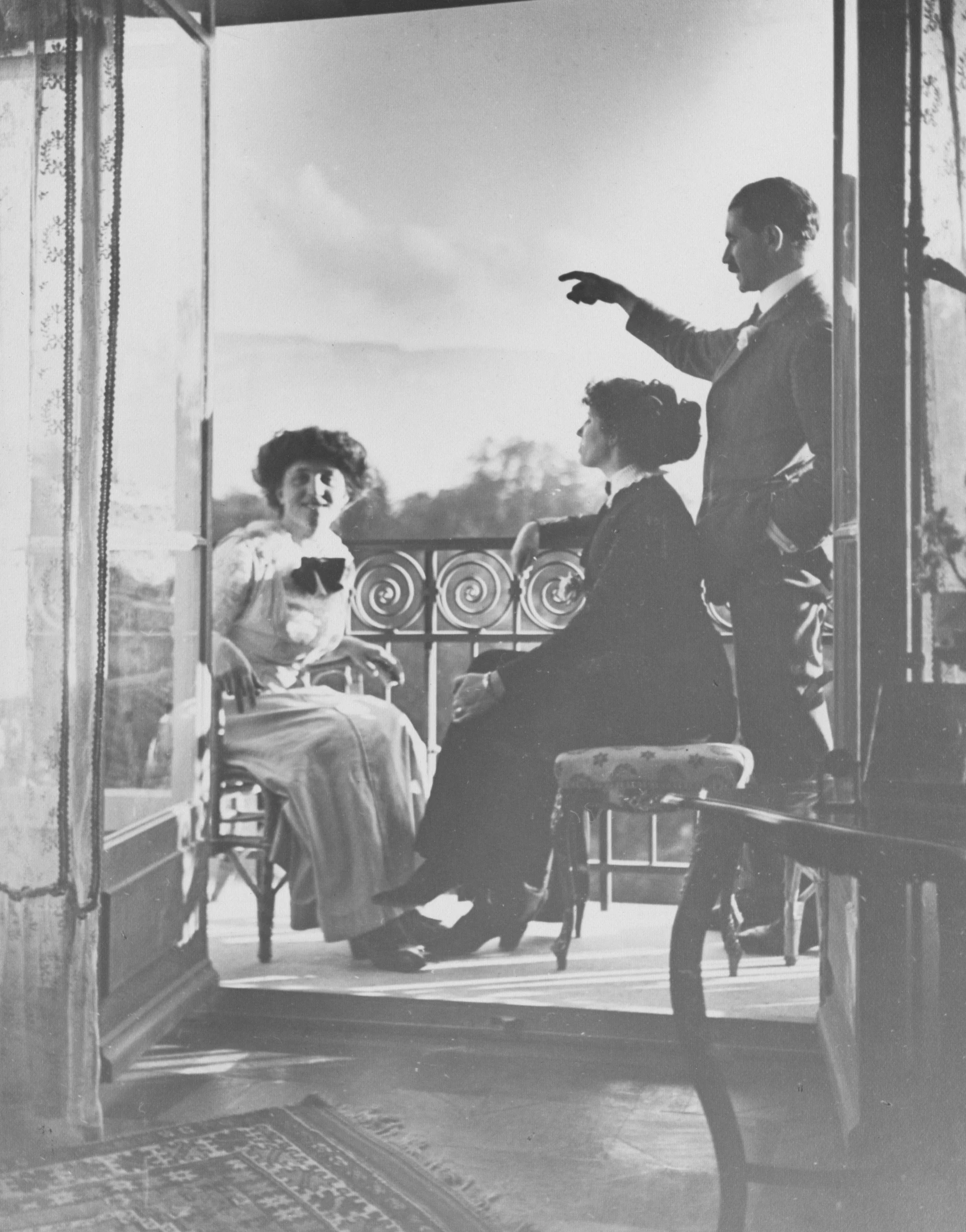 an old fashion picture of three women talking