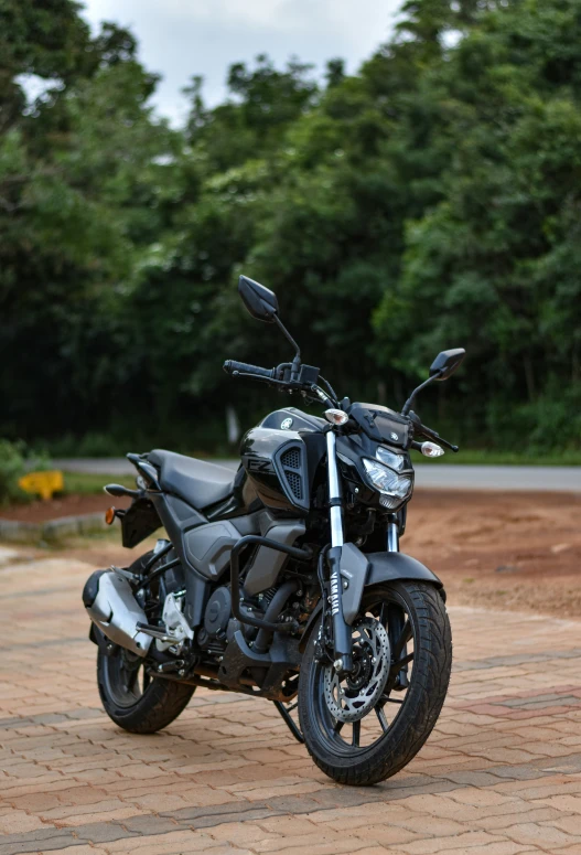 a motor cycle is parked in a driveway