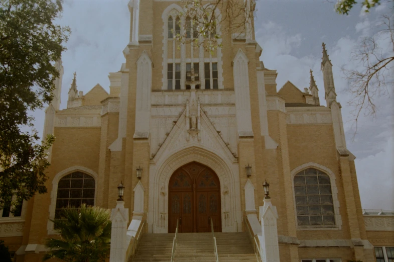 a view of a church with the steeples and a tower