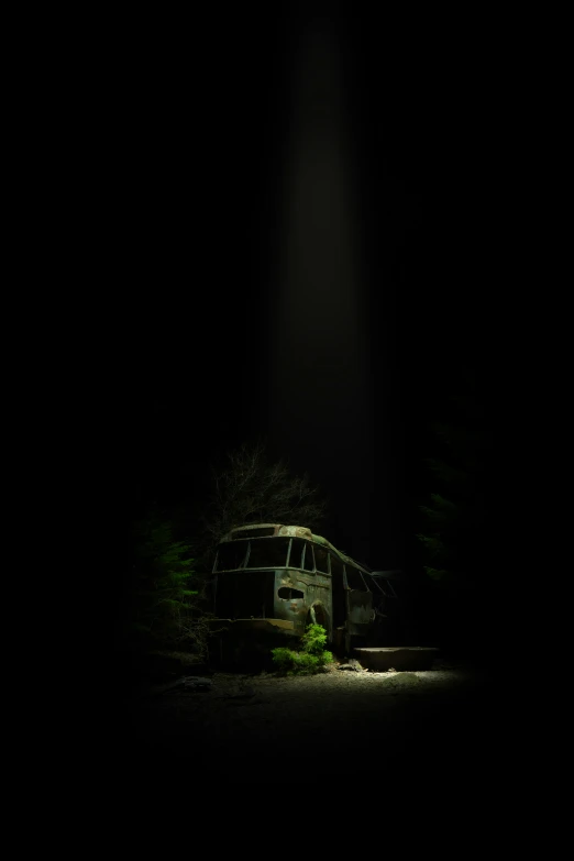 a truck parked at night in the dark with a light on