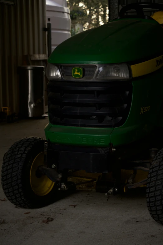 a large tractor is parked in a garage