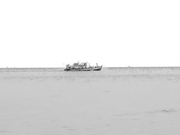 a small fishing boat out on the open sea