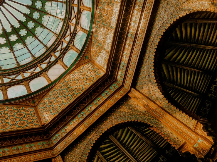 a view from a high ceiling looking up at the glass dome in the building