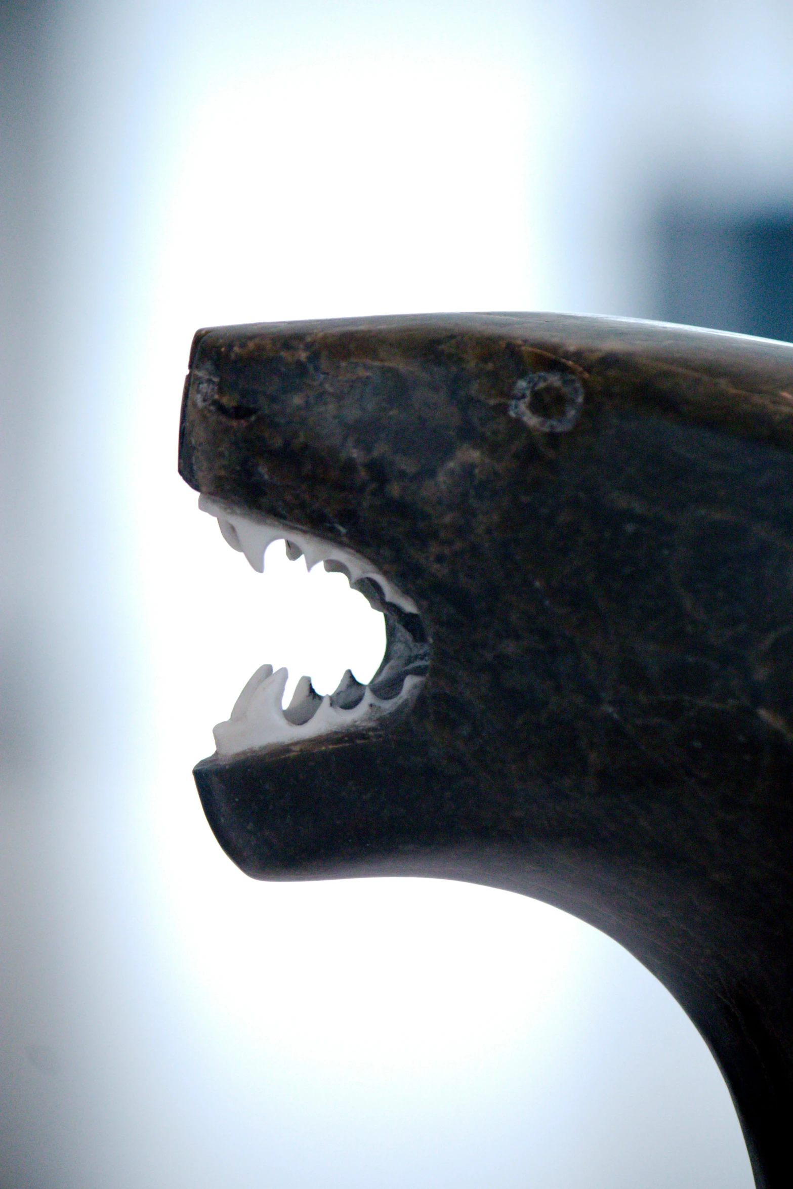 a close up s of a statue head with teeth