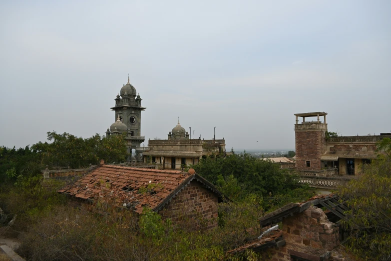 a small church with a tower sitting on top of it