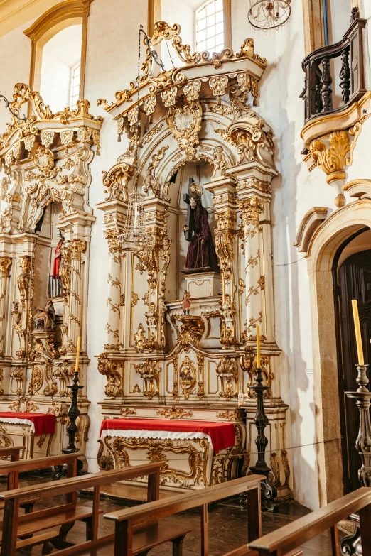 an elaborate wall inside of a church with gold decorations