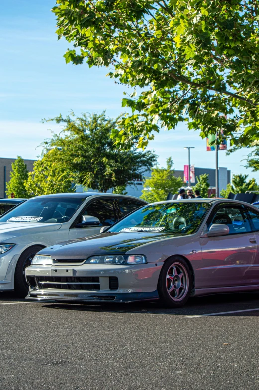 a group of three sports cars parked next to each other