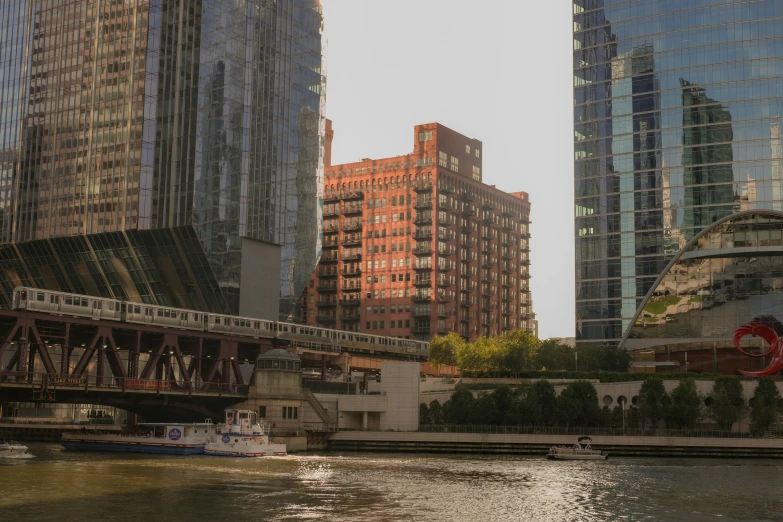 a train travels on the bridge with the skyline in the background