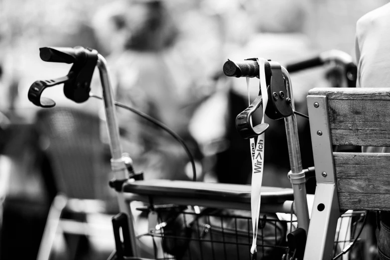 a black and white po of an old chair and a broken bike